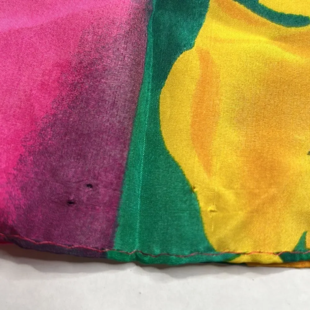 Vibrant floral silk scarf with gold purple pink and red flowers.